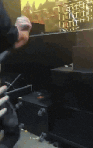 a man is holding a gun in front of a screen that says ' a ' on it