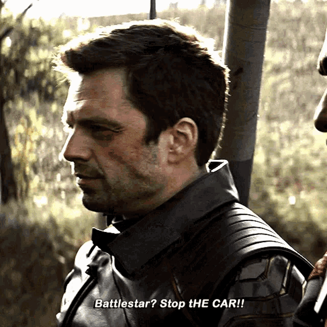 a man in a black leather jacket says " battlestar "