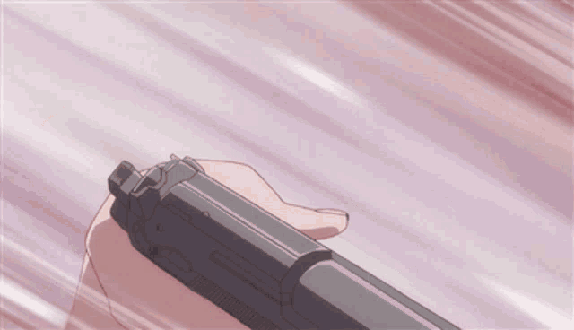 a person is holding a gun in their hand