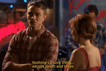 a man and woman are talking and the man says " nothing 's a sure thing except death and taxes " in yellow letters