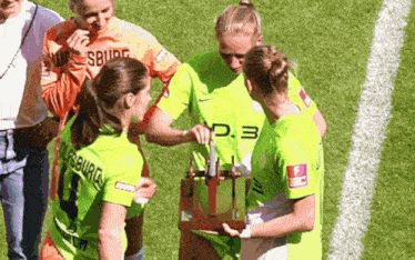 a group of female soccer players one of whom is wearing a jersey with the number 3 on it