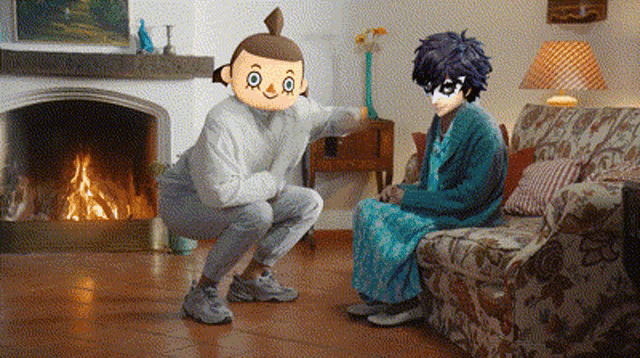 a man squatting next to a woman sitting on a couch in a living room .