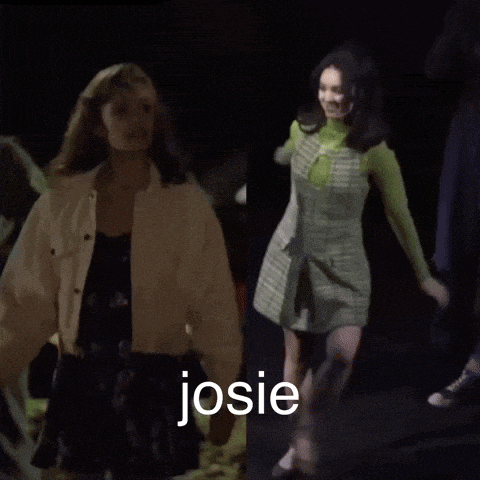 a woman in a white jacket is standing next to a woman in a green dress with the name josie written on the bottom