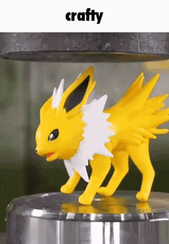 a yellow and white pokemon toy with the word crafty on the bottom