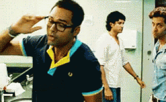 a man wearing glasses and a blue and yellow shirt