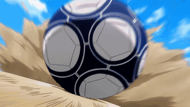 a soccer ball is rolling on the ground in a cartoon