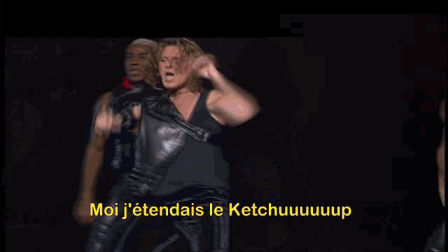 a group of people are dancing on a stage with the words moi j'etendais le ketchuuuup in yellow