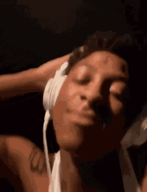 a close up of a person wearing headphones .