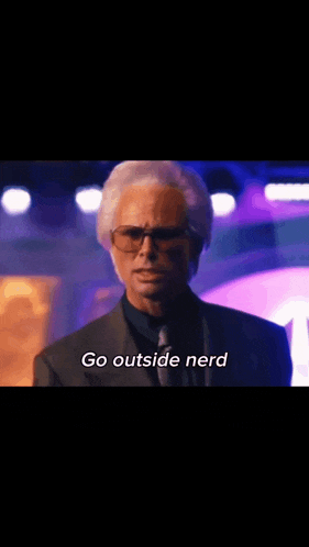 a man in a suit is saying go outside nerd