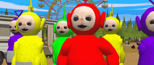 a group of teletubbies are standing next to each other in front of a ferris wheel