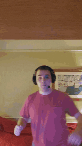 a man wearing headphones is laying on a bed