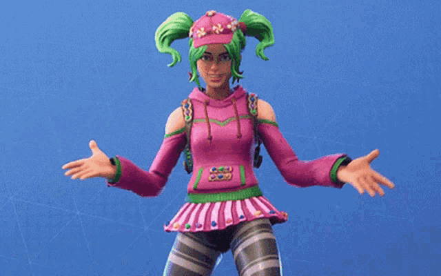 a girl with green hair is wearing a pink and green outfit and a pink hat .
