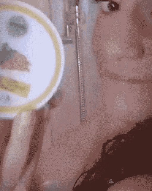 a woman is taking a picture of herself with a mirror