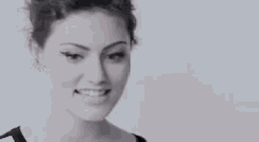 a black and white photo of a woman making a funny face