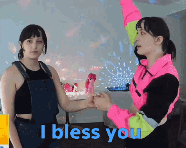 two women holding hands with the words " i bless you " behind them