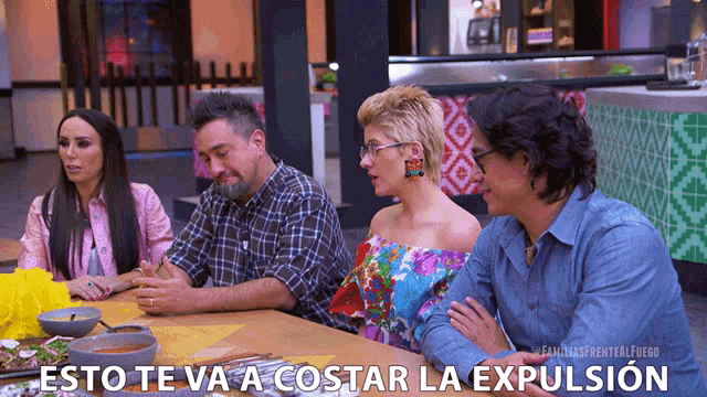 a group of people are sitting at a table with the words esto te va a costar la expulsion written on the bottom