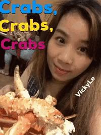 a woman is holding a large crab with the words " crabs crabs crabs " above her head