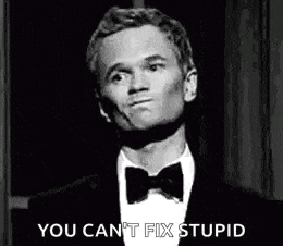 a man in a suit and bow tie is making a funny face and saying `` you can 't fix stupid '' .