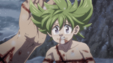 a little girl with green hair is being held by a person