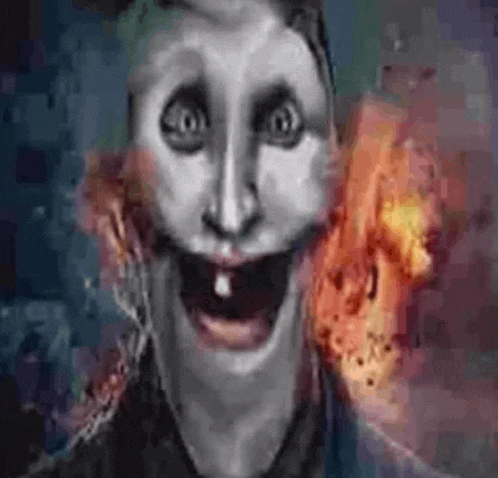 a close up of a person 's face with a toothless smile and a fire in the background .