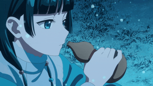 a girl with blue eyes is holding a bottle in her right hand