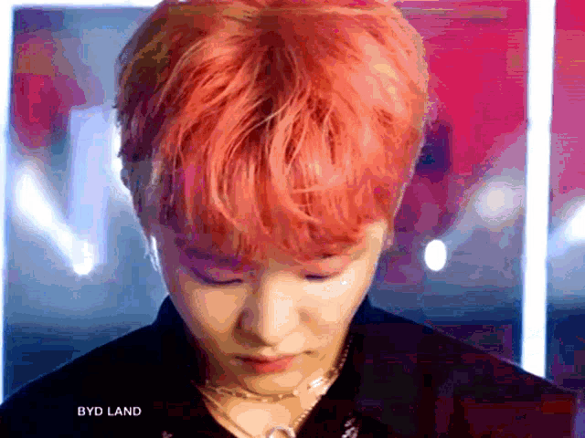 a close up of a person 's face with the words byd land written on the bottom