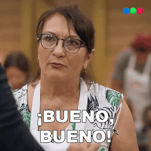 a woman wearing glasses and a white apron says bueno bueno