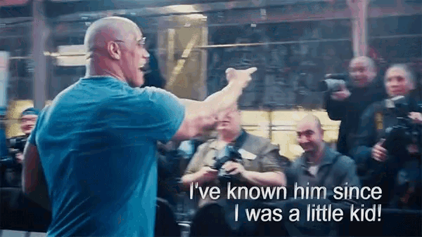 a man in a blue shirt says " i 've known him since i was a little kid " in front of a crowd
