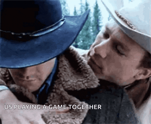 two men are playing a game together and one is wearing a cowboy hat
