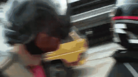 a blurry picture of a person holding a gun