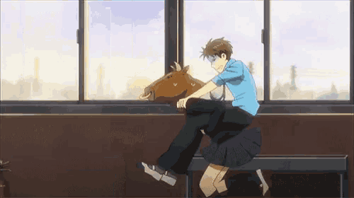 a boy is riding a girl on the back of a horse in front of a window .