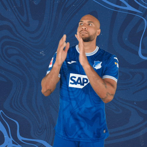 a man in a blue shirt with the word sap on the front