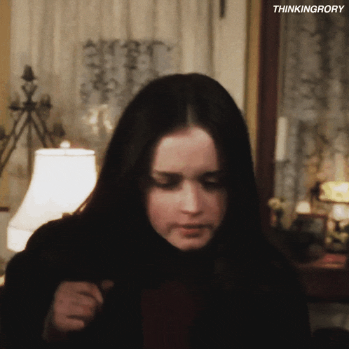 a close up of a woman 's face with the words " thinkingrory " below her