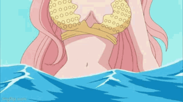 a woman in a bikini is floating in the ocean .