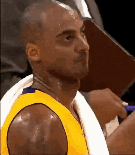 a basketball player with a towel on his neck