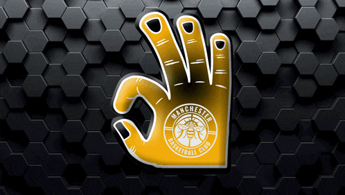manchester basketball club logo on a yellow hand