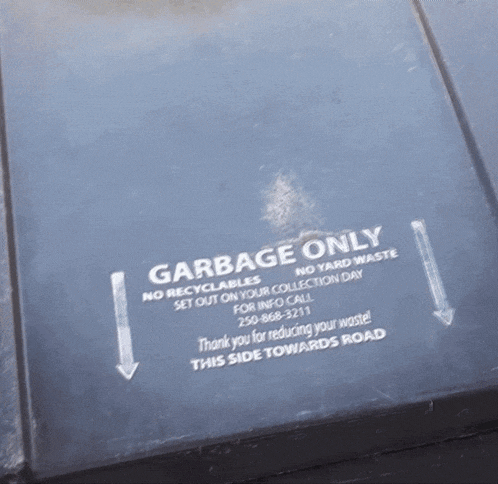 a garbage only sign on the side of a trash can