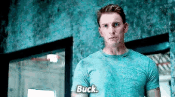 a man in a blue shirt says buck on his shirt
