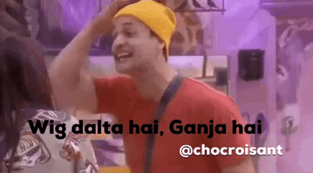 a man wearing a yellow hat and a red shirt says wig dalta hai