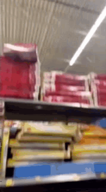 a shelf in a store with a bunch of boxes on it .