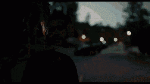 a blurry picture of a man wearing headphones and a mask