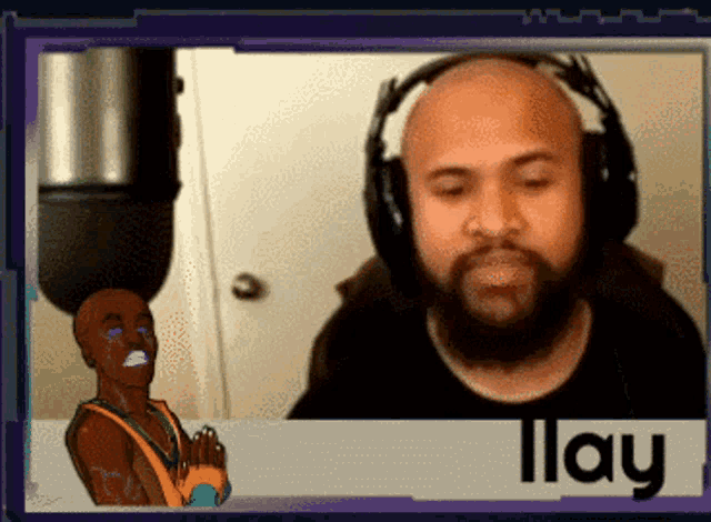 a man with a beard wearing headphones and the name lay on the bottom right