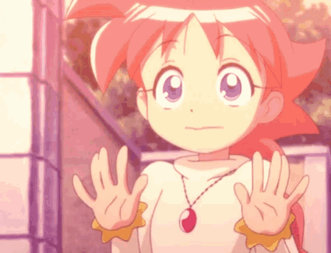 a girl with pink hair and blue eyes is wearing a necklace with a red stone