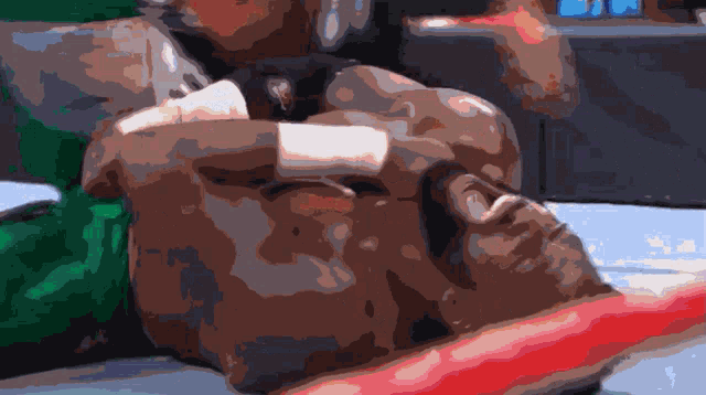 a pixelated image of a man laying down with a bandage on his face