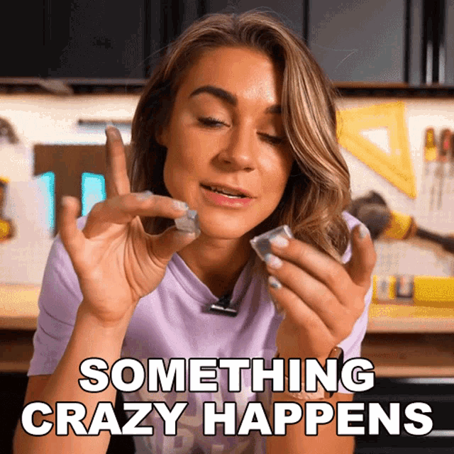 a woman is holding something in her hands and the words something crazy happens are visible