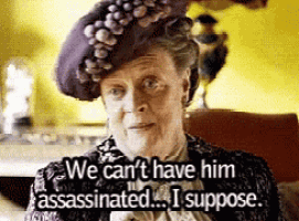 a woman in a purple hat says we can 't have him assassinated ... i suppose ..
