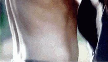 a close up of a man 's torso with a tattoo on it .