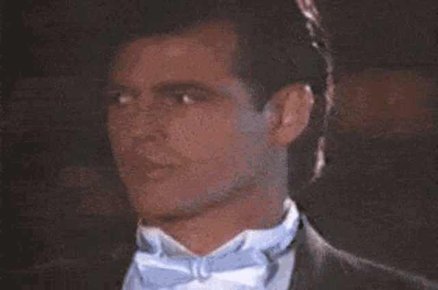 a man in a tuxedo says yea