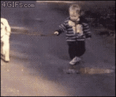 a child is walking a dog on a leash with the website 4gifs.com visible in the corner