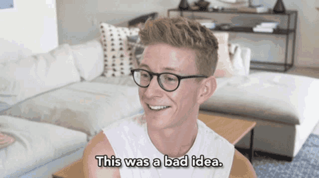 a man wearing glasses and a white shirt says this was a bad idea